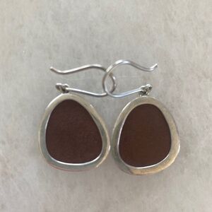 Leather and silver earrings.